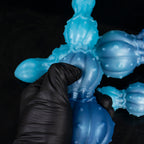 Pearl of the Myco-Web fantasy dildo – a lobe pressed by a gloved hand to show how firm it is
