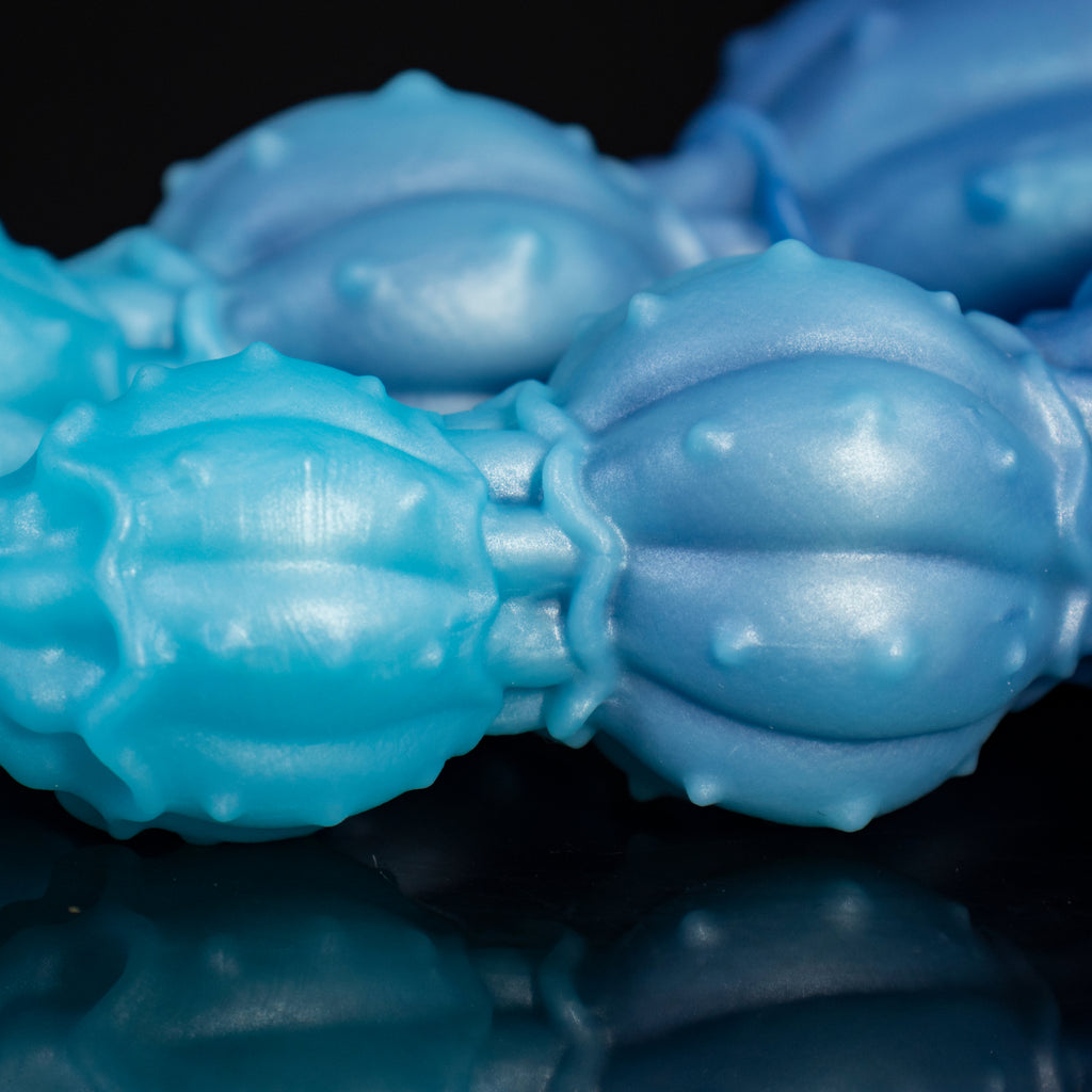 Pearl of the Myco-Web fantasy dildo – macro of the studded lobe surface and a separating groove