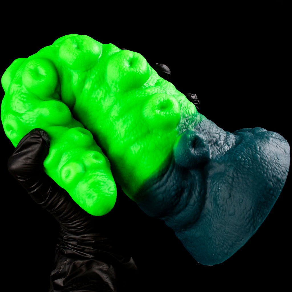 Tentacle of the Myco-Web dildo – gloved hand gripping the widest section just above the base
